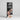 Jaja black Hair Shampoo box on a shelf with a man's face on it.

